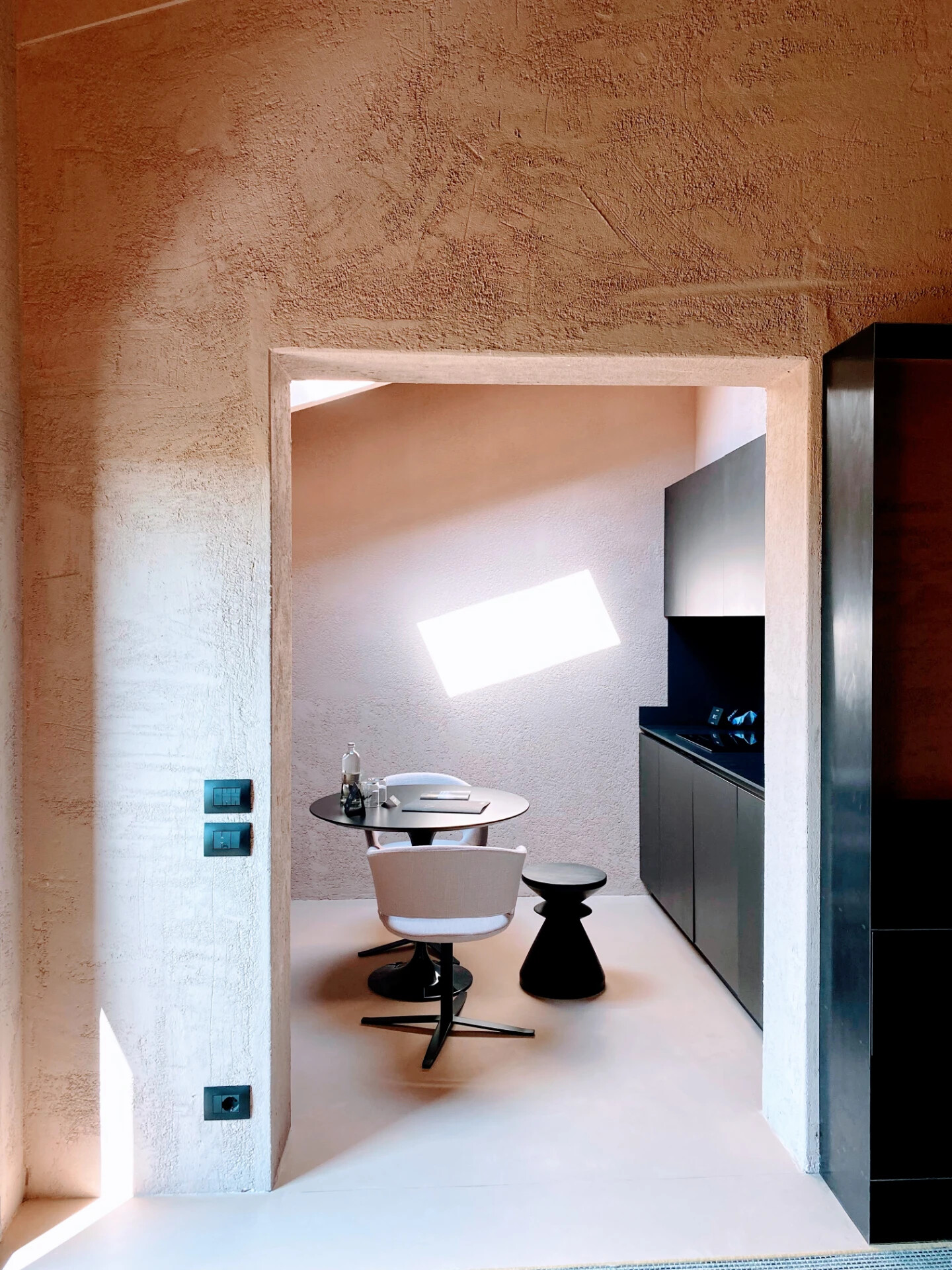 Refined hotel interior with warm textured walls and natural light