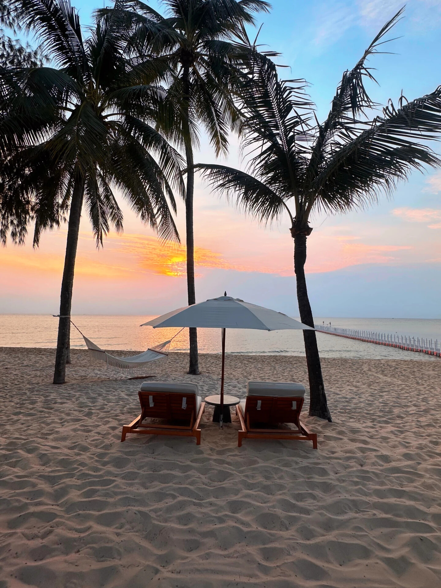 Quiet beachfront hotel setting at sunset